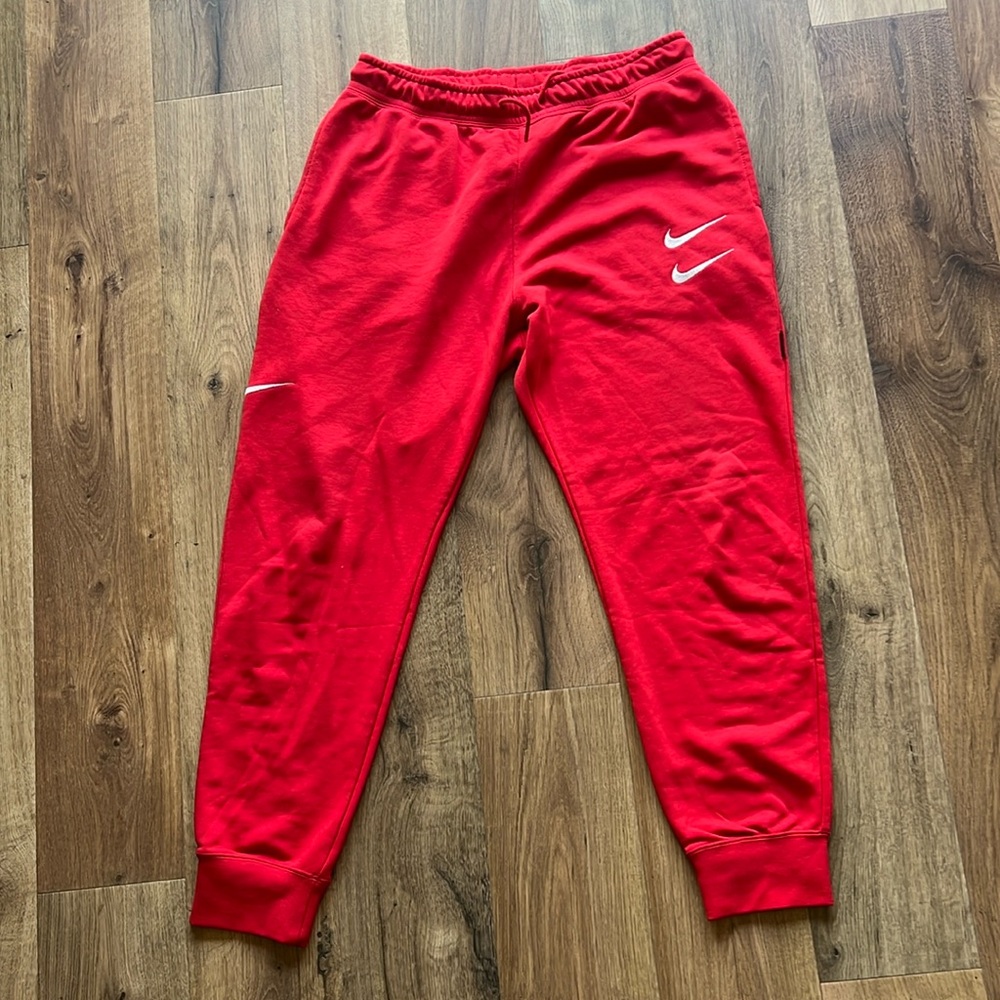 Red Nike sweat pants. Size Large